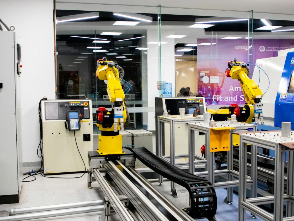 Industrial robotic arms operating on an automated smart factory assembly line