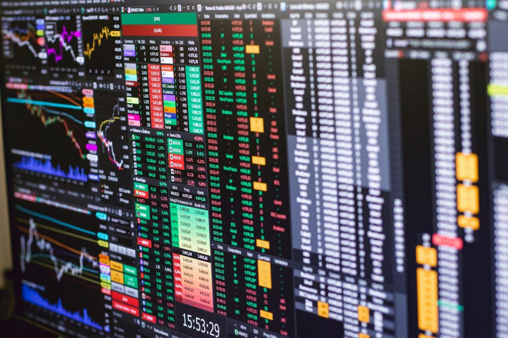 Stock exchange trading floor with digital screens showing an AI company's market debut