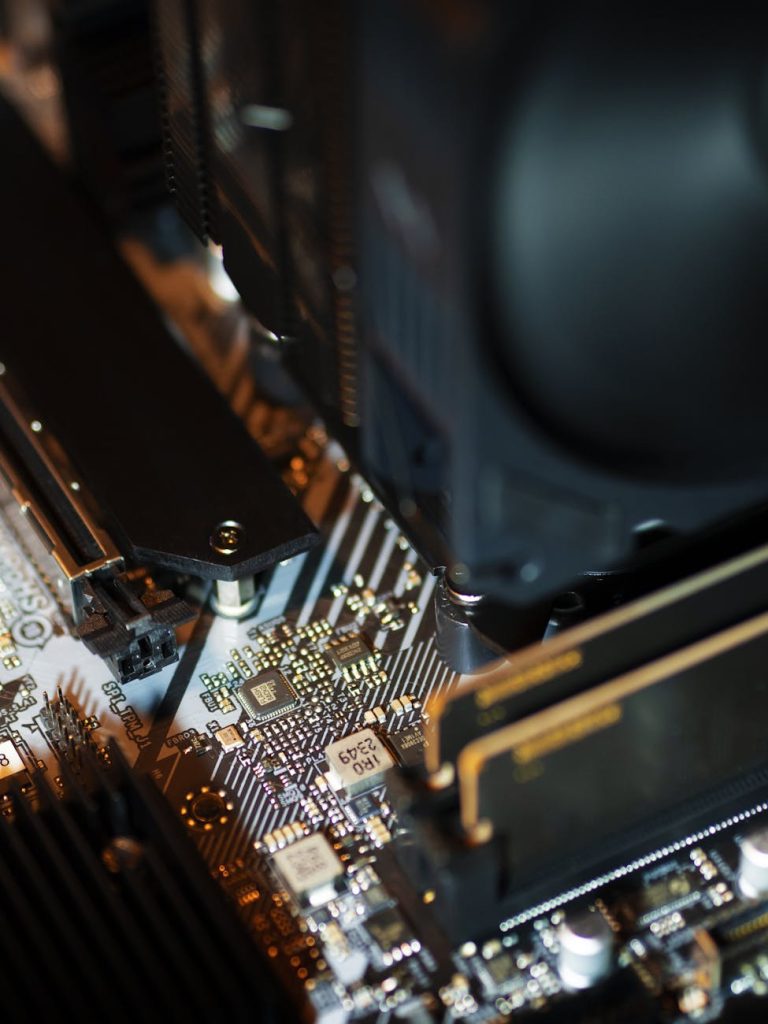 AI chip and stacked high-bandwidth memory modules on a lit display stand at a technology trade show