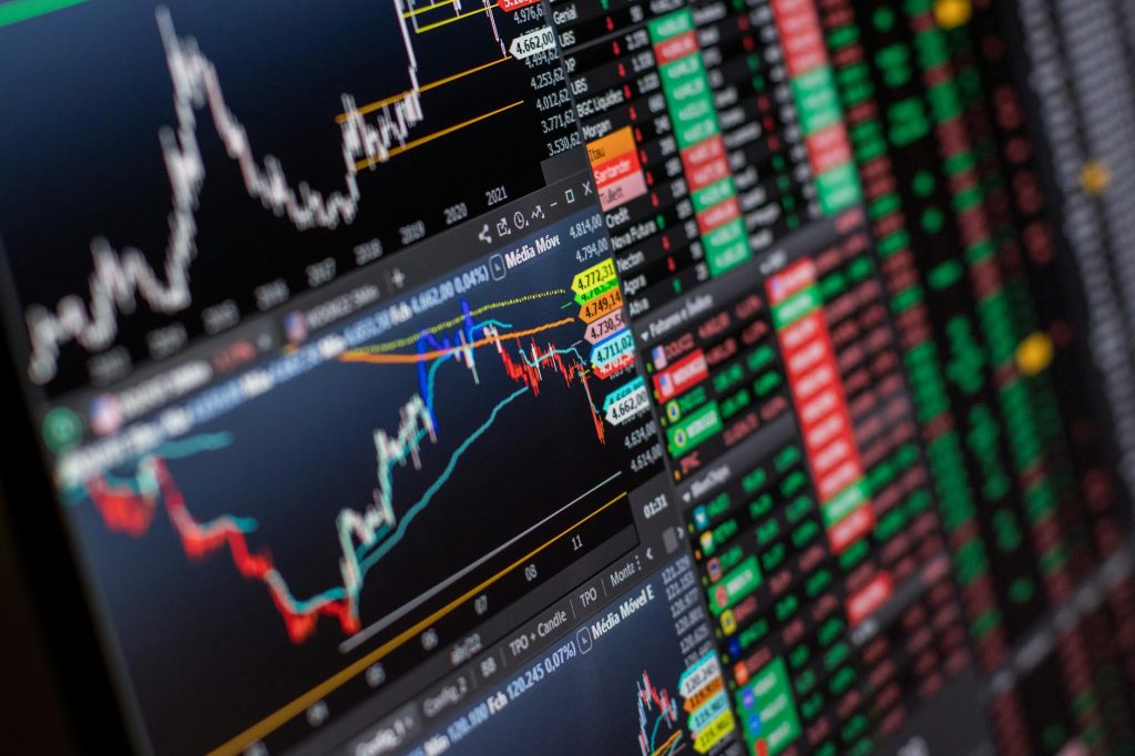 Stock exchange trading floor with digital tickers and glowing AI network graphics overlay
