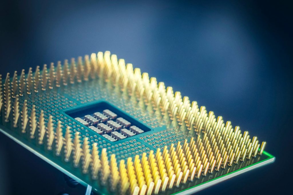 Close-up of a stacked high-bandwidth memory chip module displayed on an exhibition stand