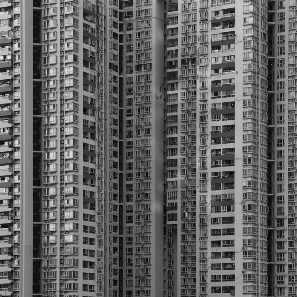 Aerial view of high-rise apartment towers along the Han River in Seoul at golden hour